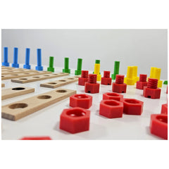 Colorful screws and connectors with wooden boards from Alexander Maly Constructor Junior Race Car Set on a white surface.