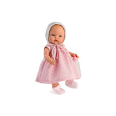 Alex baby doll in a pink polka-dot dress with bonnet, holding a baby bottle.