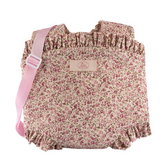 Floral baby carrier with pink ruffled edges and strap, designed for dolls 30-46 cm from the ASI Dolls Martina Collection.