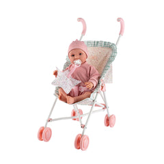 Doll in pink outfit sits in a white stroller with pink wheels and patterned fabric from the ASI Cloe Collection.