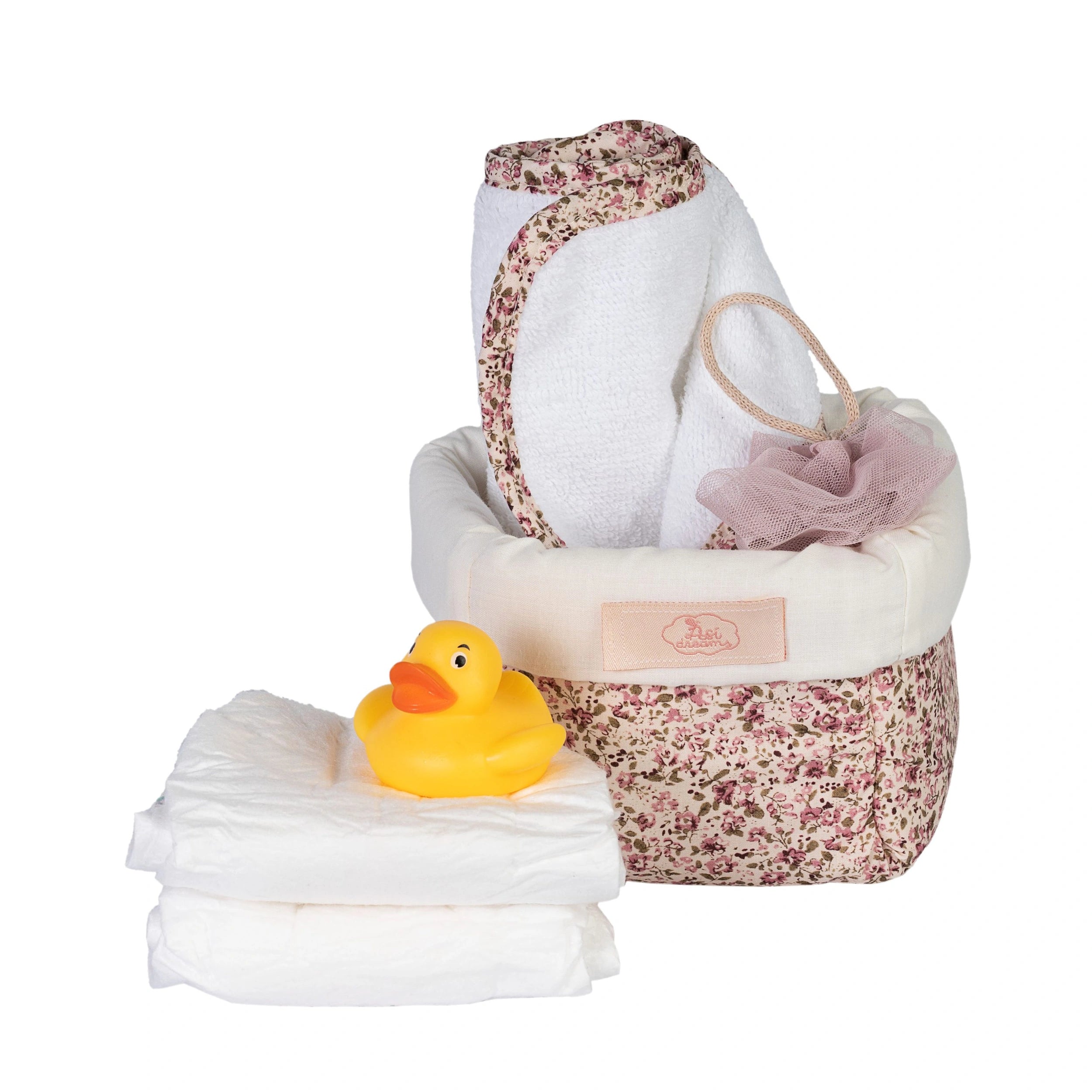 Quilted floral basket with a towel, pink bath pouf, rubber duck, and baby diapers for 36-50 cm dolls.