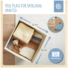 Whale storage box with soft fabrics inside, measuring 32 cm, showcasing cute teddy bear toy and neutral colors on a textured background.