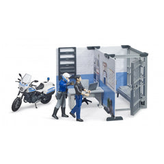 Police station playset with officer figure, motorcycle, and suspect; features desk, chair, and jail cell in a realistic setup.