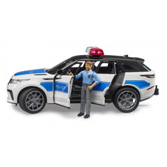 Bruder Range Rover Velar Police toy with officer figure, blue and white design, open doors, red light on top.