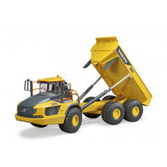 Yellow and gray Bruder Volvo A60H toy hauler with raised dumper, six large tires, and detailed cabin design.