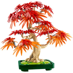 LEGO Botanicals Japanese Red Maple Bonsai Tree featuring vibrant red and orange leaves, intricately designed, set in a dark green pot.