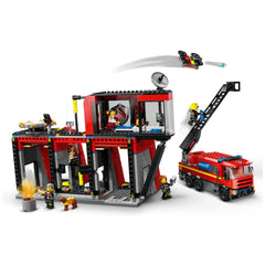 LEGO City Fire Station set featuring fire truck, five firefighter minifigures, and fire dog. The building has a control center, kitchenette, and garage.