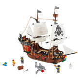 LEGO® Creator 3in1 Pirate Ship set showcasing a detailed ship with white sails and a skull flag, surrounded by three minifigures, a shark, a parrot, and treasure chest.