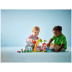 Two children playing with the LEGO® DUPLO® Peppa Pig Funfair construction set, featuring colorful pieces like a Ferris wheel and slide.