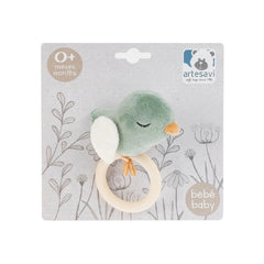 Soft green bird plush rattle with white wings and orange beak on decorative packaging, suitable for newborns.