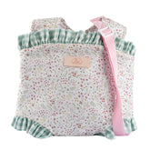 Floral-patterned baby doll carrier with pink strap and green ruffled trim, from ASI Dolls Cloe Collection.
