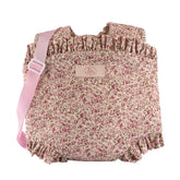 Floral baby carrier with pink ruffled edges and strap, designed for dolls 30-46 cm from the ASI Dolls Martina Collection.