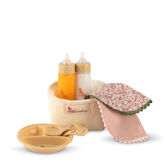ASI Dolls Martina Collection Toy Food Set featuring baby bottles, bowl, and floral-patterned bib on a plain background.