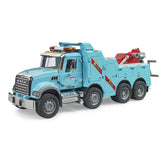 Blue Bruder MACK Granite recovery truck with light and sound features, six wheels, and red towing equipment.