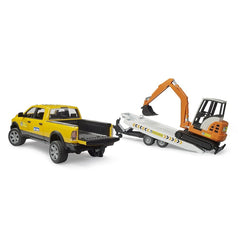 Yellow toy truck and orange mini excavator on a white trailer, part of Bruder Construction playset.