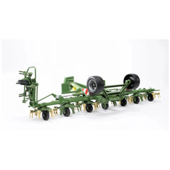 Green Bruder Krone Trailed Rotary Tedder model with realistic wheels and detailed rotary elements on a white background.