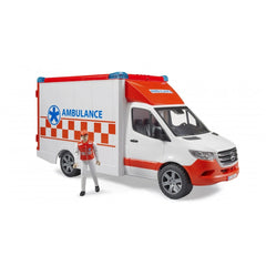 Red and white toy ambulance with driver figure, featuring realistic design and emergency markings.
