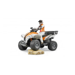 Orange and white quad toy with driver in helmet on rocky terrain, highlighting Bruder's durable design.