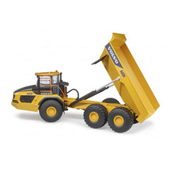 Yellow Volvo Hauler A60H toy with articulated dumper and oversized tires, showcasing realistic construction vehicle details.