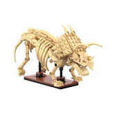 Cada Dinosaur Fossil Triceratops construction set made of tan Lego bricks on a black base, displayed in a front view.