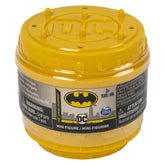 DC Comics BATMAN collectible blind box mini figure container with a yellow lid, black base, and ventilation holes.