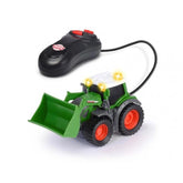 Fendt remote-controlled tractor in green with black tires, orange rims, and multiple green plastic attachments and bumpers.