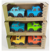 Sustainable wheat straw toy cars in blue, green, and orange, arranged in a cardboard box with eco-friendly branding.