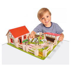 Eichhorn Little Farm Set showcasing a smiling child playing with a wooden farm, animals, and colorful structures.