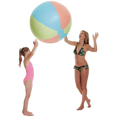 Happy People beach ball XXL 85 cm in multicolored design with girl in floral swimsuit and wet blonde hair enjoying at the bea
