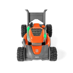 Husqvarna toy lawn mower in orange with black wheels, clear front window, and green light for pretend play.