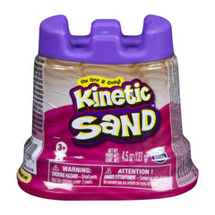Kinetic Sand container with a purple cap, featuring a gradient design and a warning label for small parts hazard.