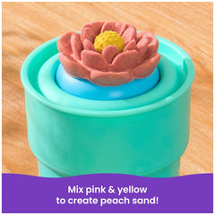 Kinetic Sand Squish Blossom features a pink and yellow flower-shaped object atop a blue container with the text "Mix pink & y