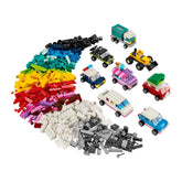 A vibrant assortment of colorful LEGO bricks in red, blue, green, yellow, and pink, alongside various assembled toy vehicles including a police car, ice cream truck, and off-road vehicle, capturing the essence of creative play.