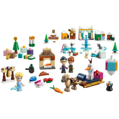 Colorful LEGO building set themed around Disney's Frozen, featuring mini figures of Elsa, Anna, Kristoff, and Olaf, along with adorable kitten characters and various festive accessories, including an ice fountain, trees, and a mini sled with Sven.