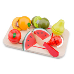 New Classic Toys Cuttingset features a wooden tray with assorted plastic fruits including apples, lemon, pear, strawberry, pi