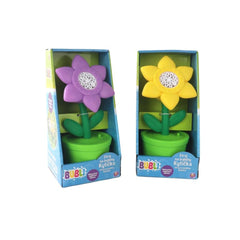 Flower Bubble Machine with purple and yellow petals, green stem, and age 5+ marking on glossy cardboard packaging.