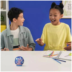 Ravensburger 3D Puzzle Ball featuring Disney characters is displayed on a table with two smiling children engaged in play.