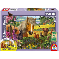 Schmidt puzzle box featuring a vibrant illustration of a horse and cats in a pastoral setting, designed for children aged 7+.