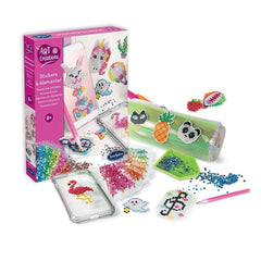 Diamond stickers craft kit in pink and white packaging with scattered glitter and colorful materials on a white surface.