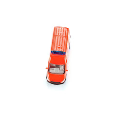 Bright orange toy ambulance with a glossy finish, featuring a front grille, headlights, and a simplistic design against a whi