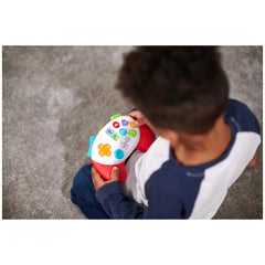 Simba ABC Game Controller: A child with a colorful toy in an indoor setting, learning and engaged with the educational toy.