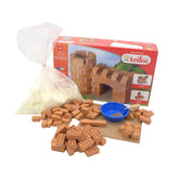 Teifoc castle construction toy set with interlocking bricks, a blue bowl, and granular material in a boxed display.