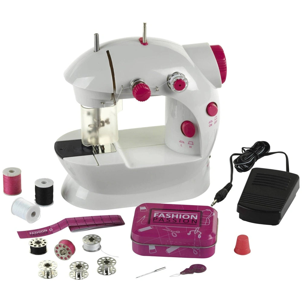 Theo Klein kids sewing machine in white with red buttons, black base, and multiple clear plastic components for arts and craf