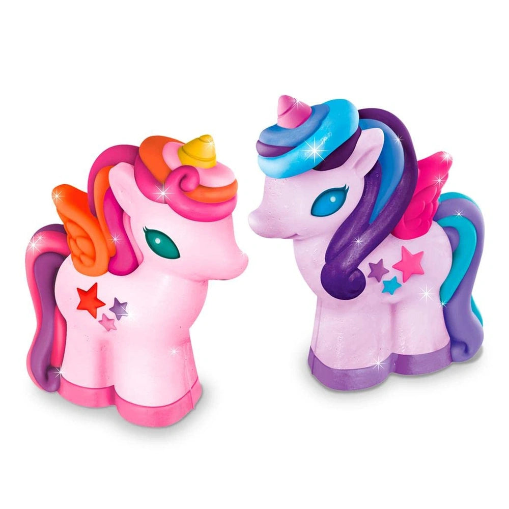 glittery pink unicorn with a glossy pink body, colorful mane, purple tail, and reflective blue eyes, adorned with stars.