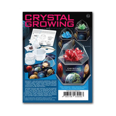 Crystal Growing Blue Edition toy playset packaging features glossy dark blue material with bold pink and red text.