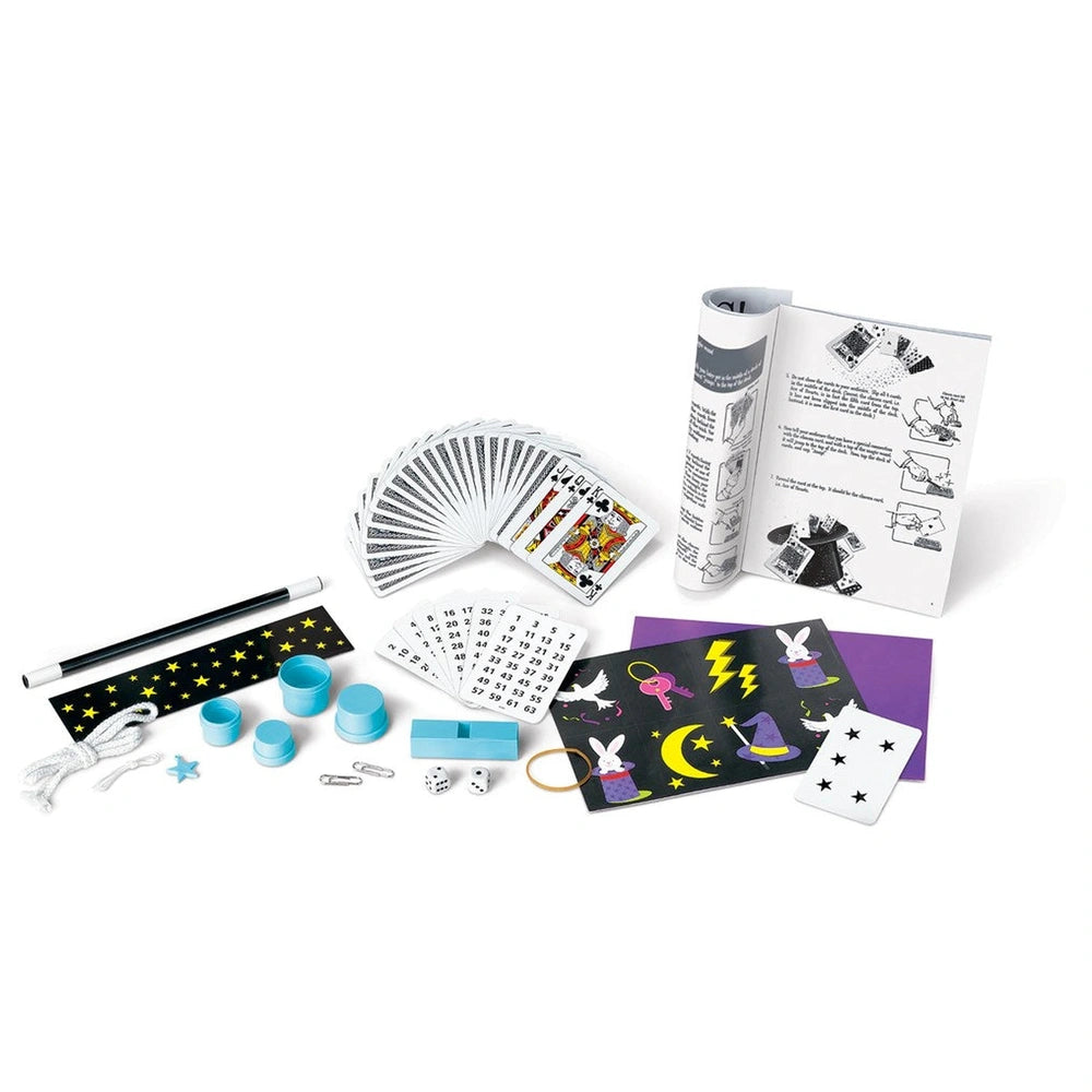 4M KidzLabs Magic Kit featuring black and white playing cards, blue and yellow plastic components, and purple starry paper.