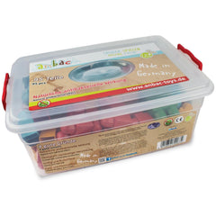 Clear plastic box with red handles, containing multicolored sanitizing bricks, labeled "Made in Germany", 95 pieces.
