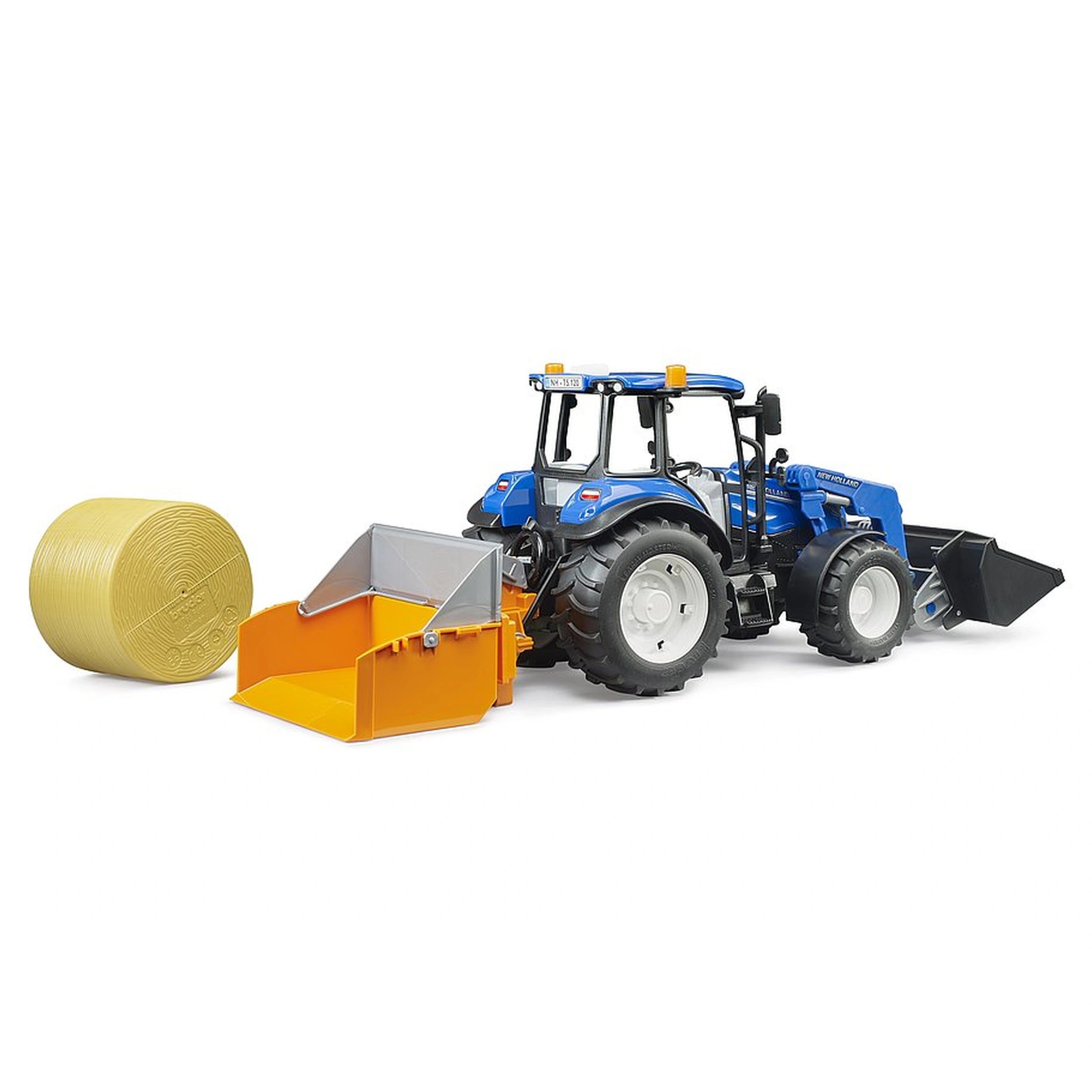 Blue Bruder New Holland T5.120 toy tractor with orange frontloader and black forks, next to a round yellow hay bale.