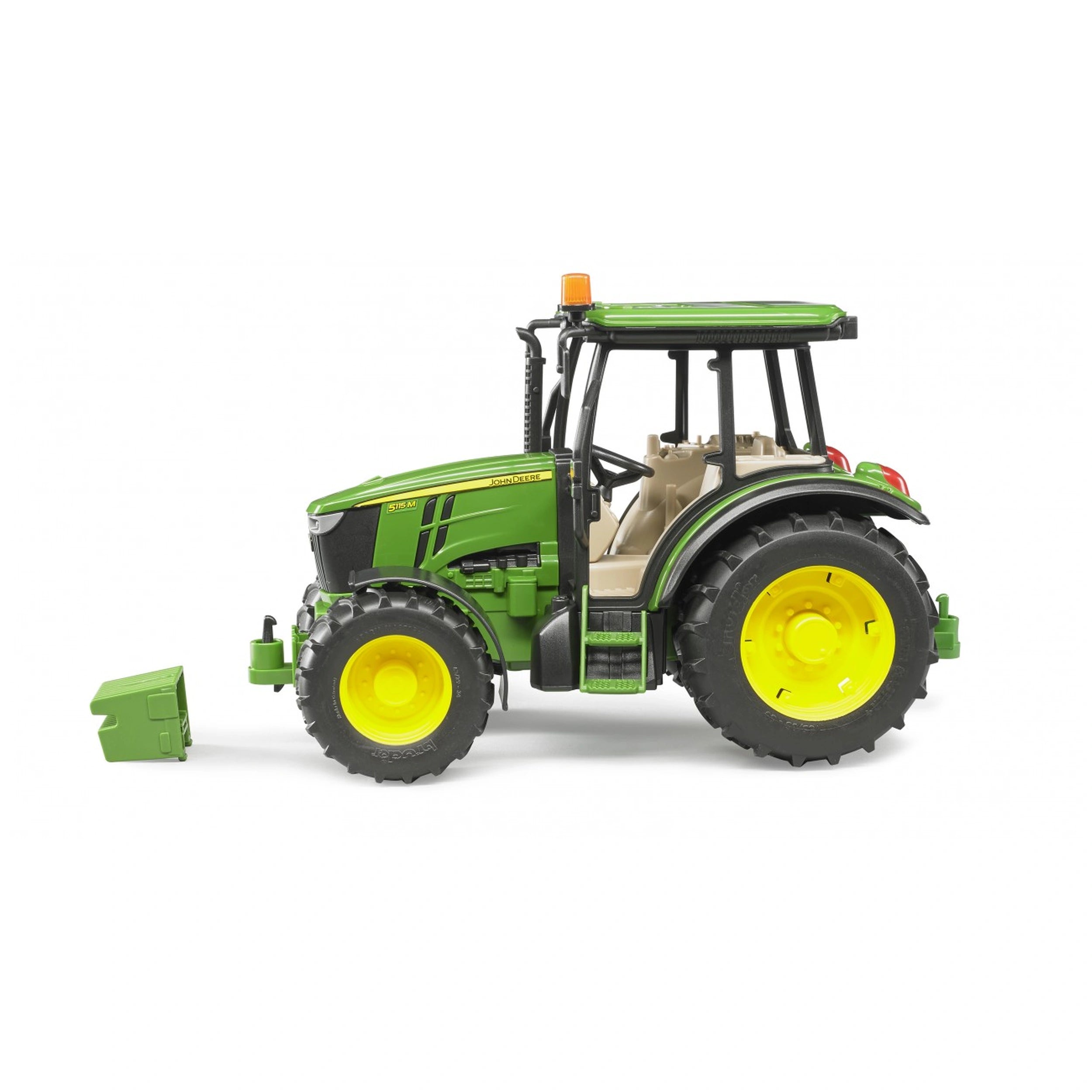 Green and yellow John Deere 5115 M toy tractor with detailed engine block on display, side view.