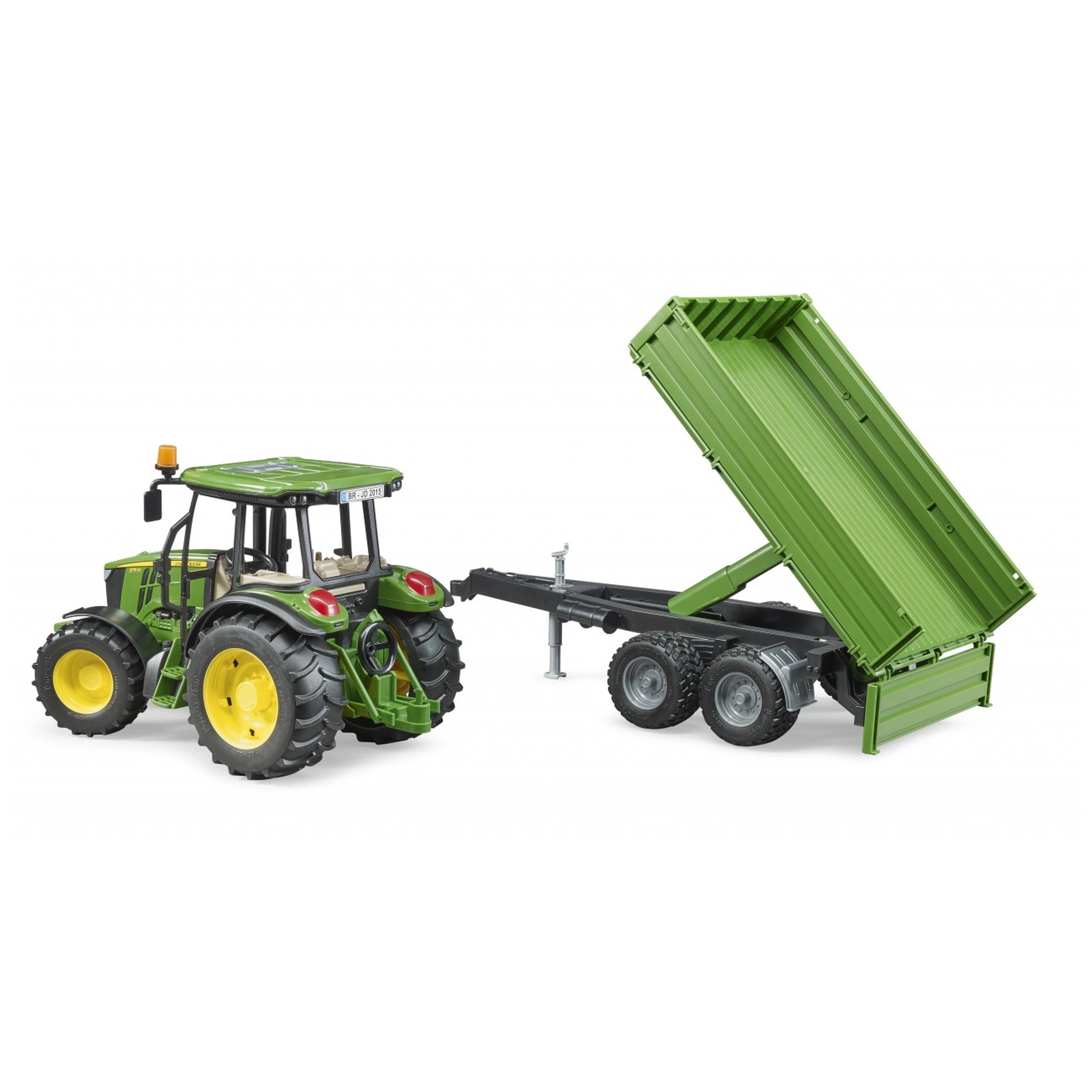Green John Deere toy tractor with yellow wheels and a tipping trailer attached.